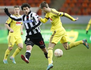 Udinese's Diego Fabbrini, left, battles for the ball with Anzhi's Arseni Logashov during their Europa league group A soccer match in Moscow, Russia, Thursday, Nov. 22, 2012. (AP Photo/Misha Japaridze)