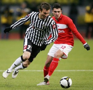 Nikita Bazhenov (R) of Russia's Spartak vies with Marco Motta (L) of Italy's Udinese during their UEFA Cup group D football match in Moscow, on November 6, 2008. AFP PHOTO / YURI KADOBNOV (Photo credit should read YURI KADOBNOV/AFP/Getty Images)